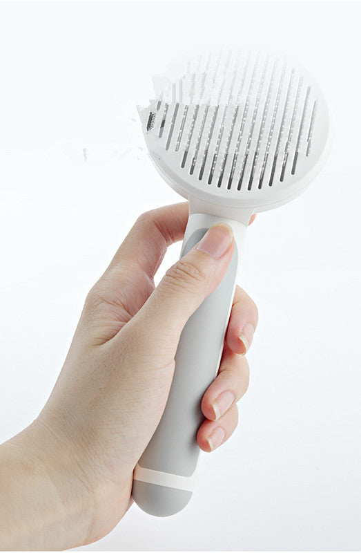 Pet deshedding comb removing loose fur
